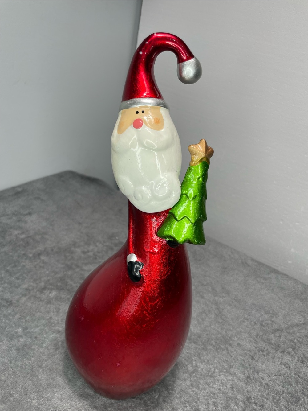 Glossy Red Porcelain Santa Figurine with Green Tree Holiday Accent